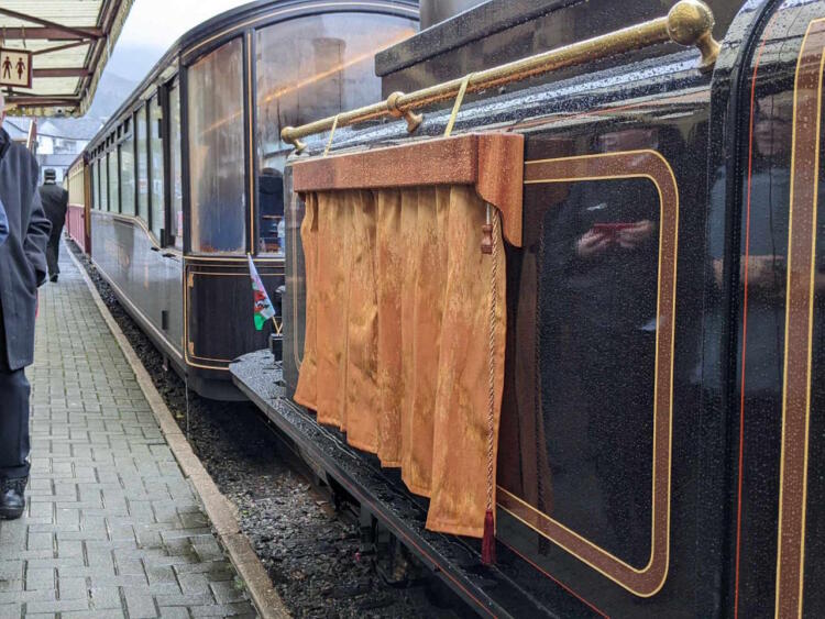 James Spooner, curtain covered nameplate