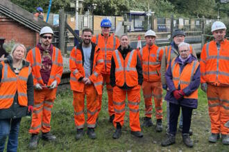 Lancashire railway workers thank Hindley by helping in station garden