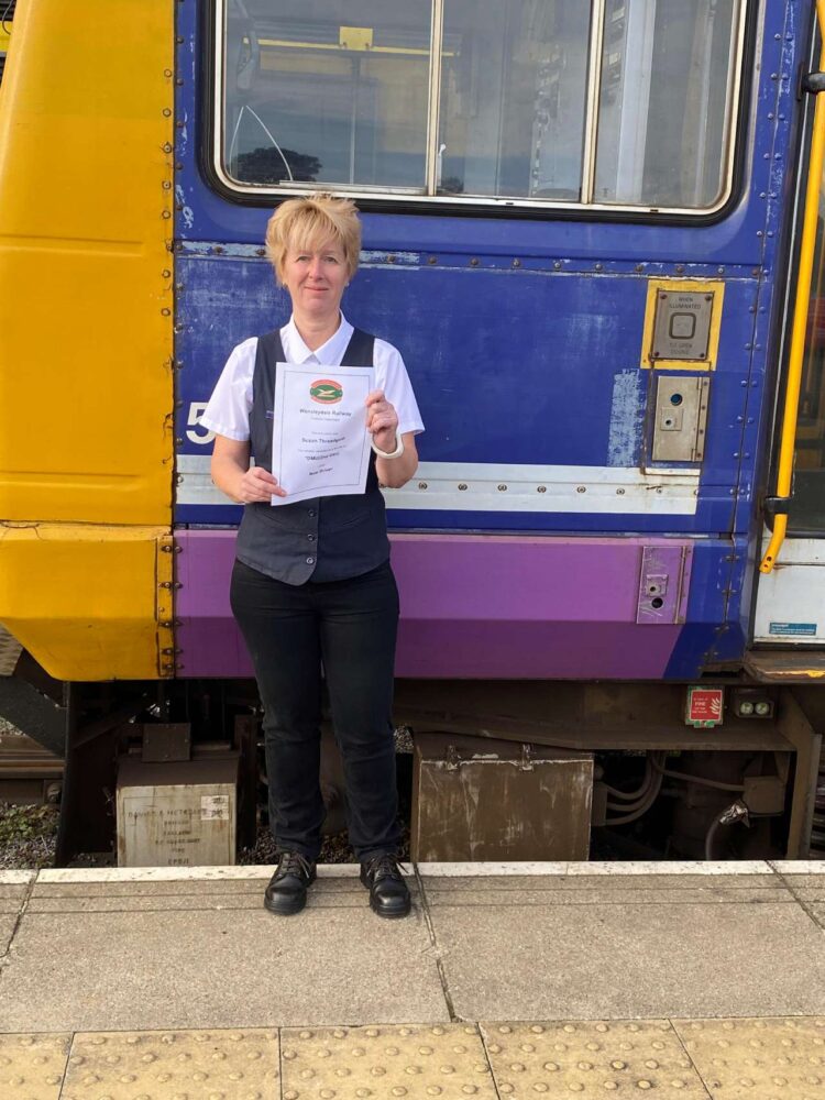 Sue with her certificate