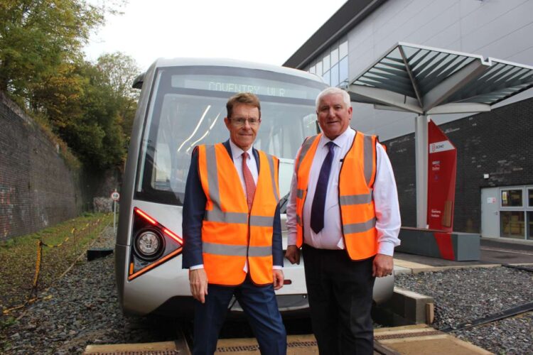 Andy Street, Mayor of the West Midlands and Cllr Patrick Harley, leader of Dudley Council checking the new CVLR tram on track at the Very Light Rail National Innovation Centre