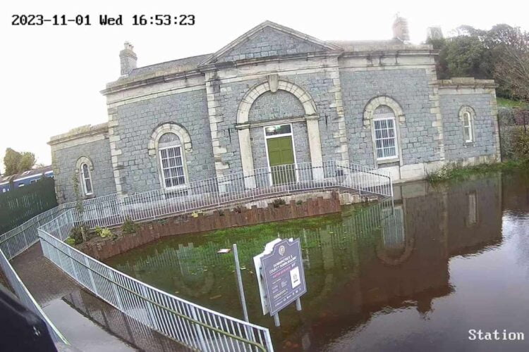 The front of the station seen on CCTV at the height of the floods, with water lapping at the steps.