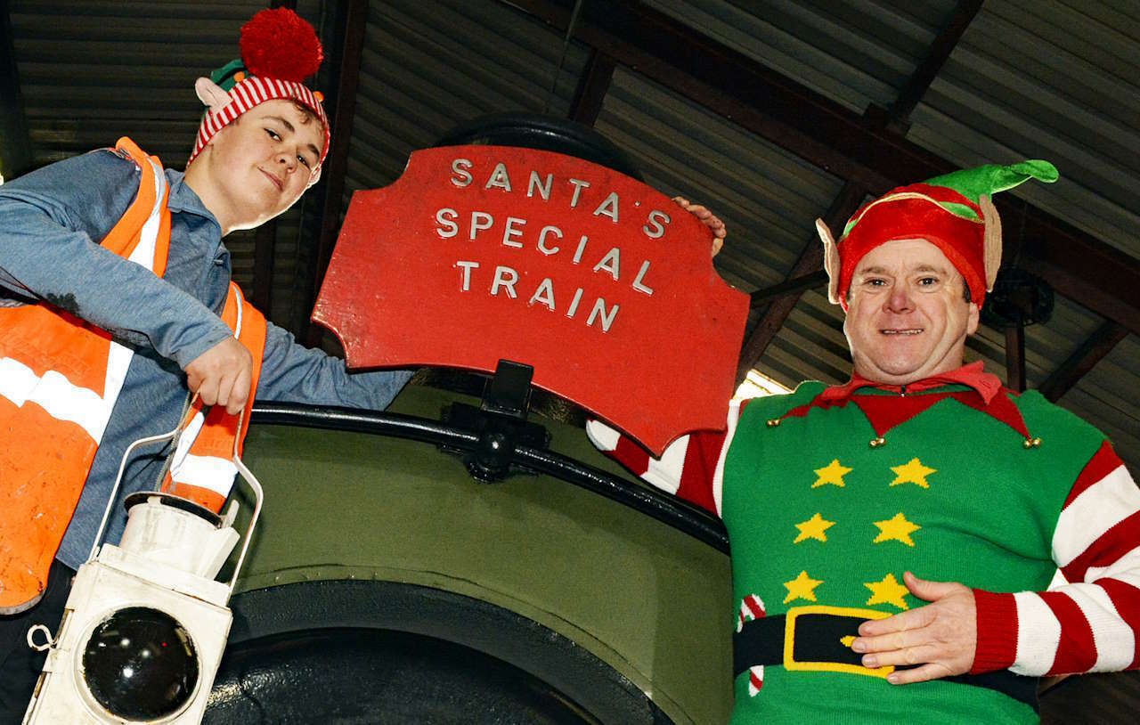 CHR Volunteer Harrison Gillham alongside Santa Helper David Roberts gearing up for the Cambrian Santa Specials