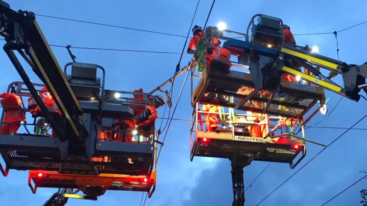 Networ Rail engineers working on maintenance of overhead line equipment, // Credit: Network Rail