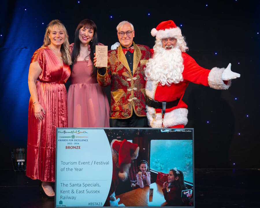 (L to R): Fran Downton, Chief Executive of Tourism South East; Alice Fry from Award sponsors Touch Stay; Robin Coombes, General Manager of the Kent & East Sussex Railway; Santa Claus