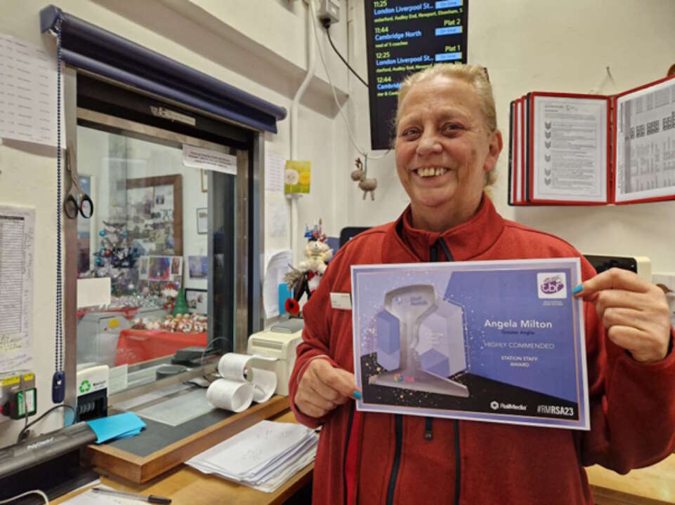 Angela poses with her certificate