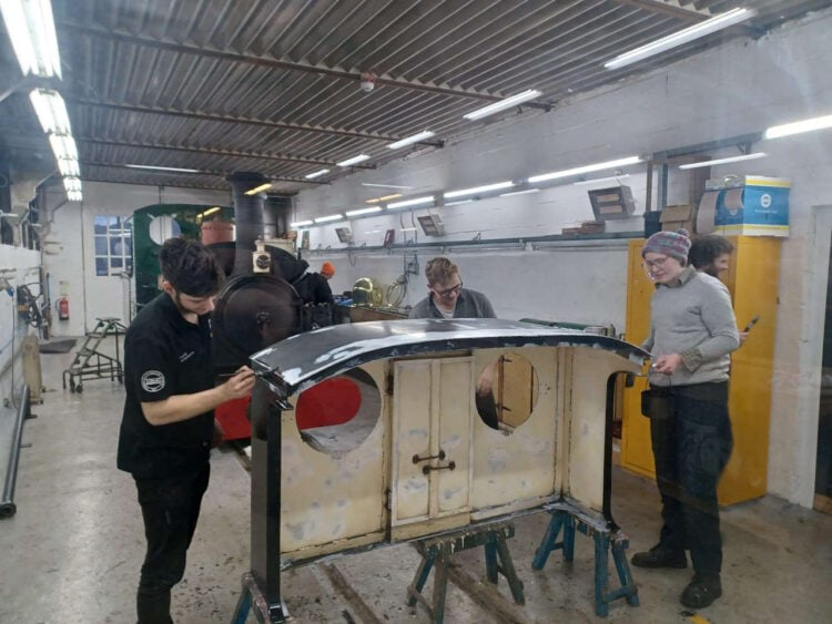 Volunteers busy giving LINDA its new paint job. // Credit: Ffestiniog & Welsh Highland Railways