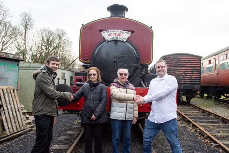 Former owners of Albert, centre, are thanked by PVR volunteers. 