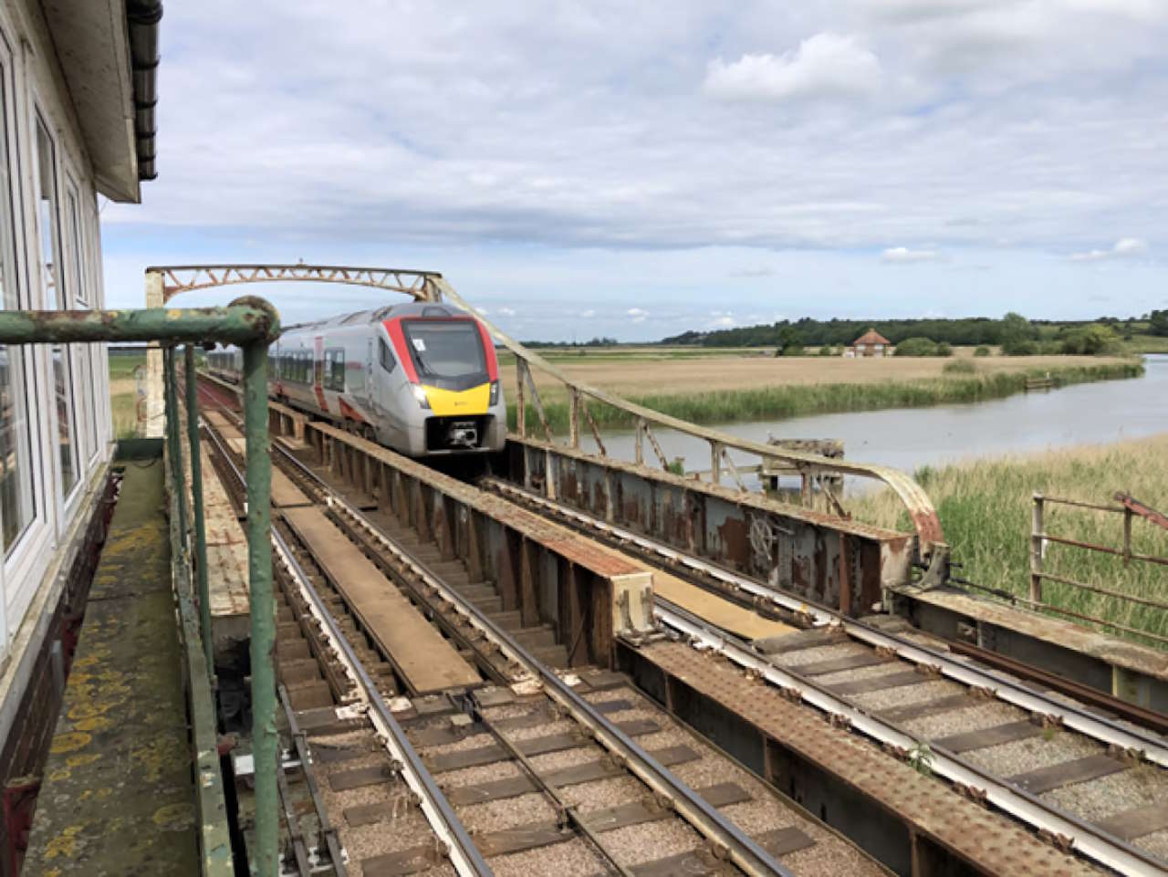 A Greater Anglia train passes over Somerleyton swing bridge