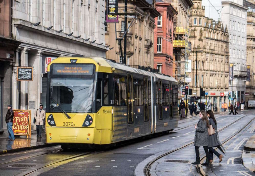 Metrolink tram on Cross St, Manchester city centre