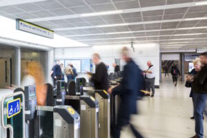 Passengers passing through the ticket barriers at Blackfriars Station