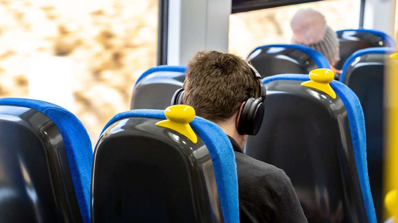 Customer onboard a Northern train. // Credit: Northern