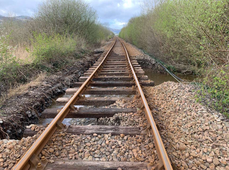 Picture from near Dolgarrog station on the Conwy Valley Line after river flooding washed away ballast on 9 April 2024