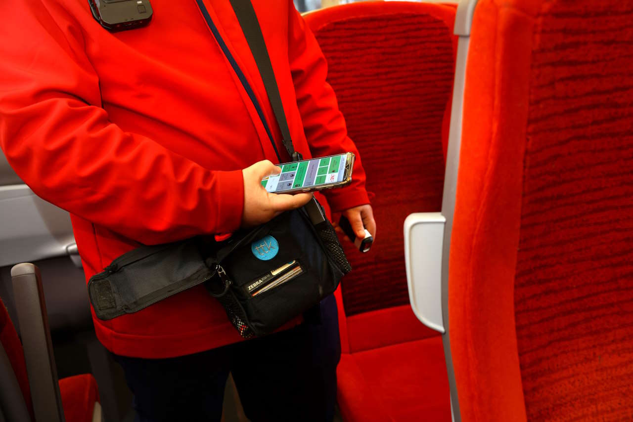 London North Eastern Railway conductor checking tickets. // Credit: London North Eastern Railway