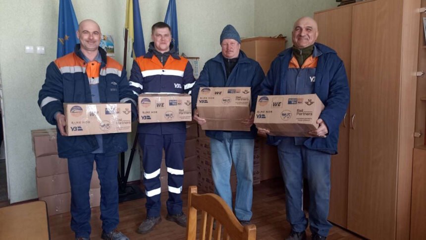 Ukrainian Railway employees with donated parcels. // Credit: Rail Partners.