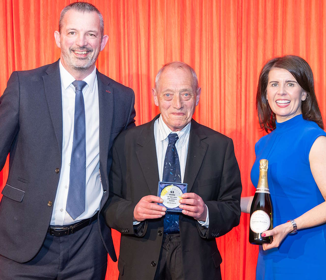 David Hunter with his long-service award. // Credit: Merseyrail