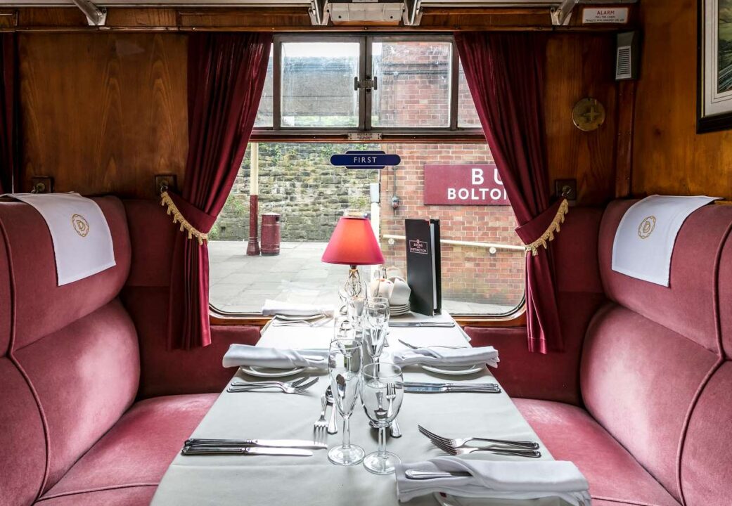 A table set for Father's Day dinner on an East Lancashire Railway train.