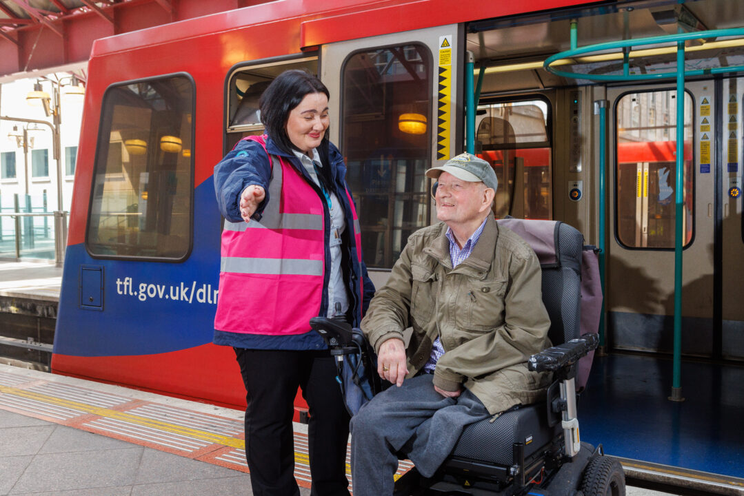 Picture of TfL staff assisting a passenger