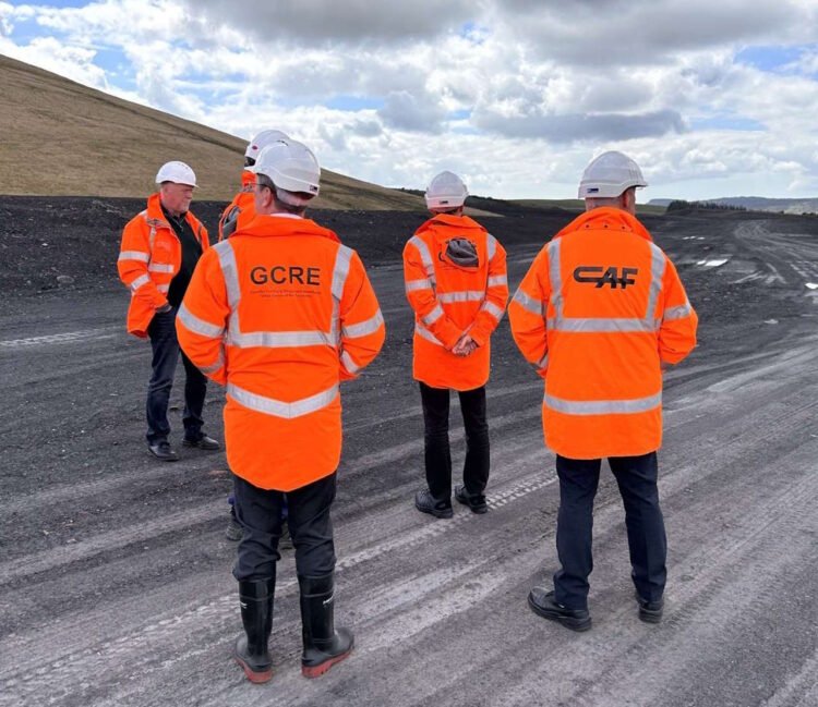 CAF and GCRE directors view the construction site.