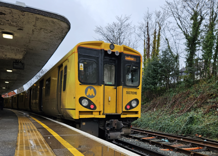 507 001 stands at New Brighton on a showery day ready to carry passengers into Liverpool. P.Knapton/Class 507 Preservation