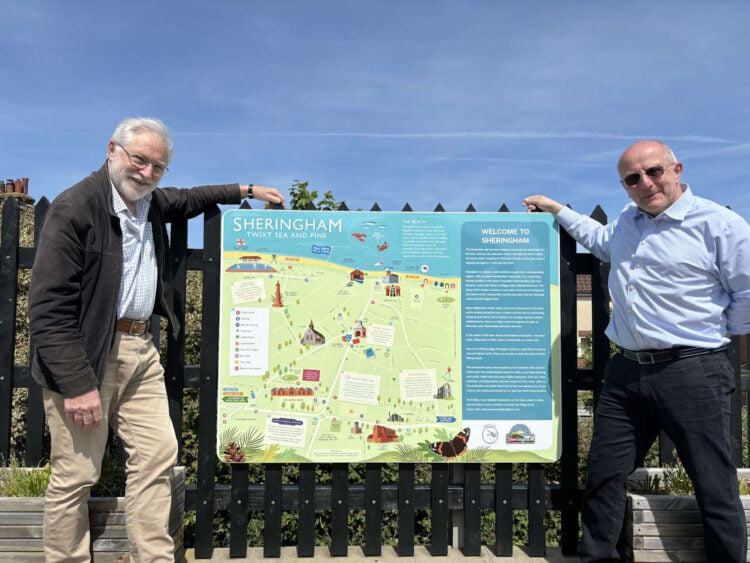 Sheringham Town Map installed on the station platform Left Bittern Line Chair David Pearce and Right Paul Raymond from Experience Sheringham Courtsey Bittern Line CRP