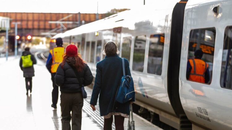 Two customers about to board a Northern train - Northern