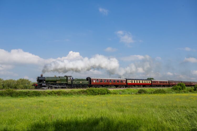 A new steam locomotive No. 6880 Betton Grange heads through the Cotswold fields - Jack Boskett