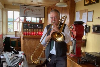 Musician combines trombone practice with volunteering on Welsh railway