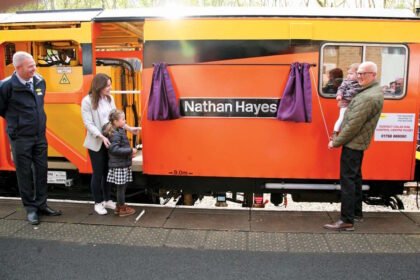 Nathan’s wife, Lucy, daughters Emily & Alice and father, Derek unveiled the nameplate. // Credit: Alex Hall/Rail Infrastructure Magazine
