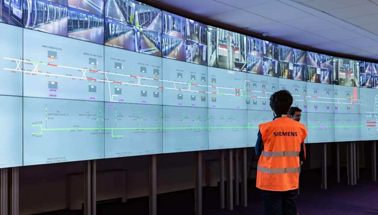 Person Looks at cctv and signalling diagram