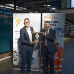 Stuart Heaton, Managing Director of Learn Live and Rail Safe Friendly presents the Rail Safe Friendly Gold Disc to John Smith, CEO of GB Railfreight at Euston Station