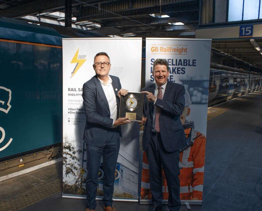 Stuart Heaton, Managing Director of Learn Live and Rail Safe Friendly presents the Rail Safe Friendly Gold Disc to John Smith, CEO of GB Railfreight at Euston Station