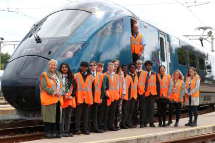 Students with a new Evero train