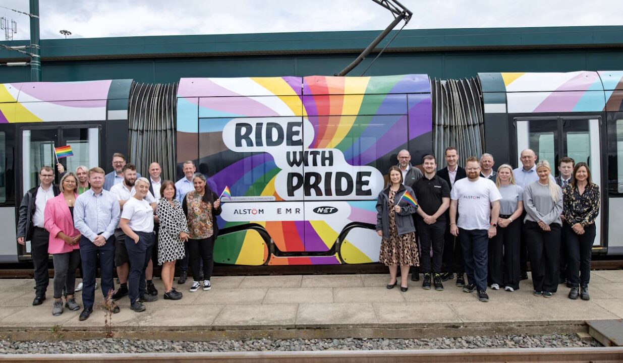 Alstom and Nottingham Express Transit staff next to tram 213 reliveried in Pride livery. // Credit: Nottingham Express Transit