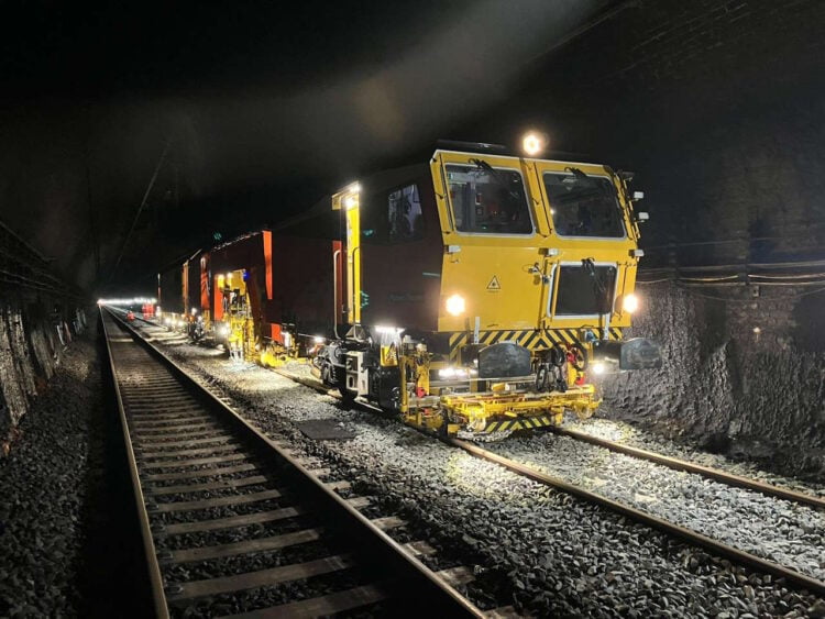 Tamper at work after renewing track in the Severn Tunnel. // Credit: Network Rail