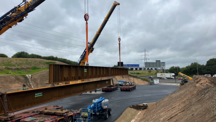 The beams being lowered into the worksite by the M62. // Credit: Network Rail