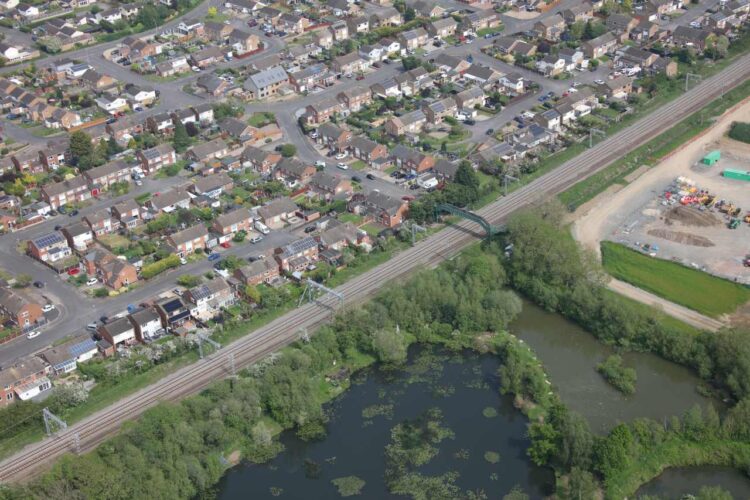 Viewed from the air, new powerlines and relaid track pass through the south midlands - Network Rail