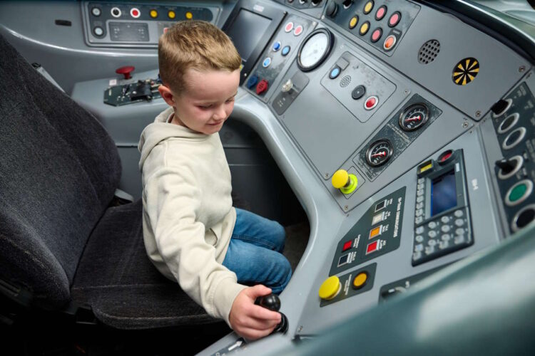 Five-year-old Daniel Rogerson at the controls of a Pendolino training simulator. // Credit: Avanti West Coast