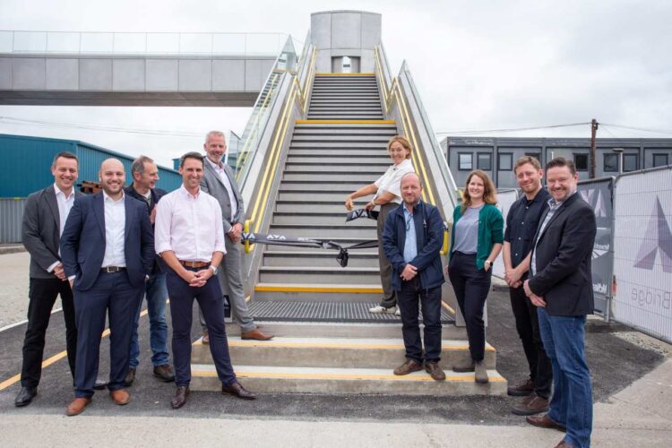 Ribbon cutting with representatives of the consortium behind the AVA bridge at McNealy-Brown's yard in Kent - Network Rail