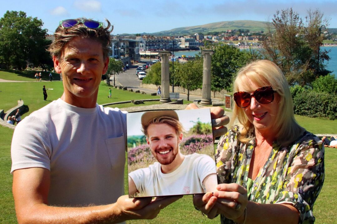 Vicki and Jonathan Searle, with a picture of their son Henry