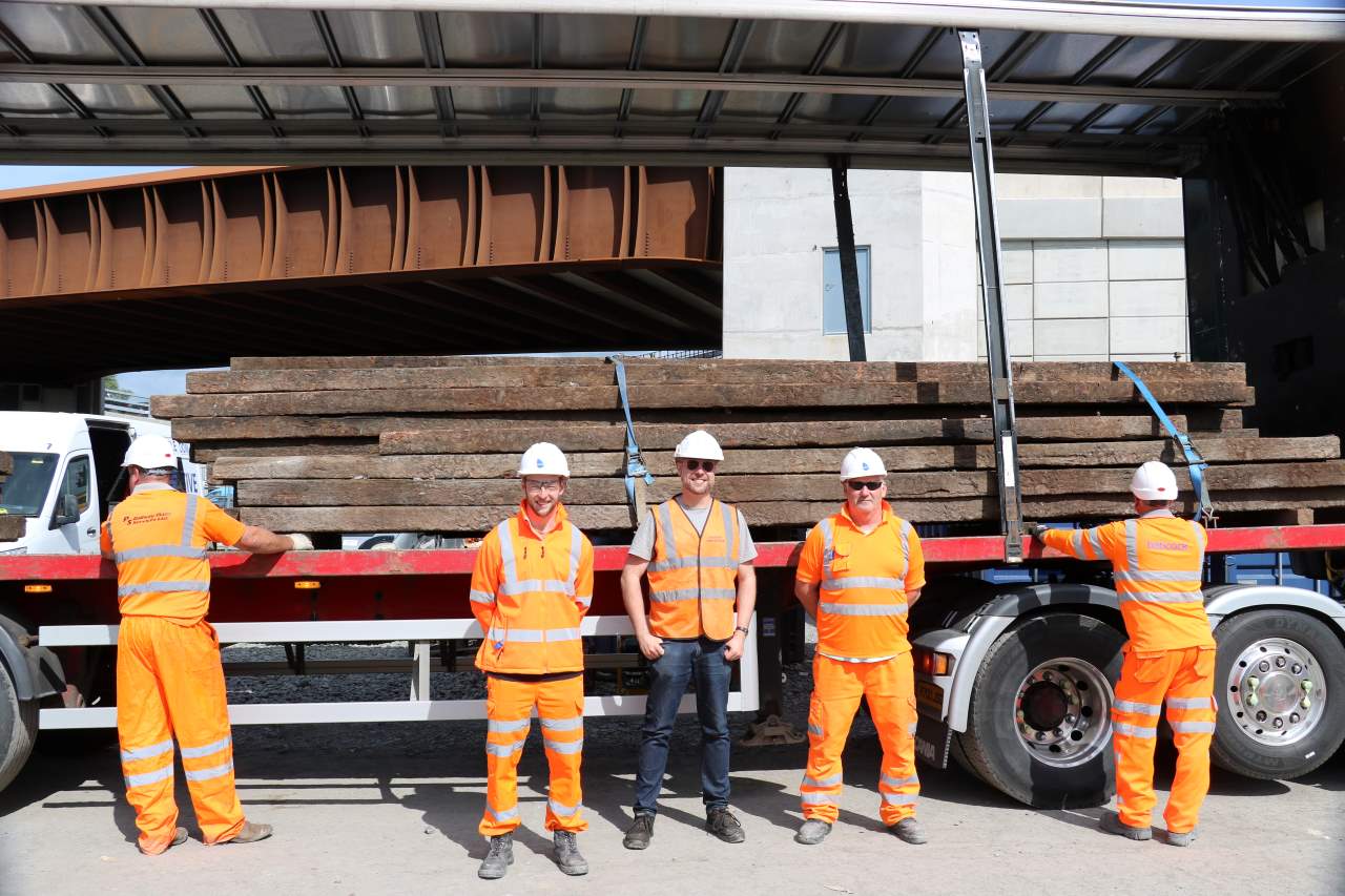 Robert Gardiner (centre) with Babcock's Greg Ramsay, Project Manager and David Hutchinson, Senior Construction Manager with the sleepers under Belfast Grand Central Station's new bridge. - Downpatrick & County Down Railway