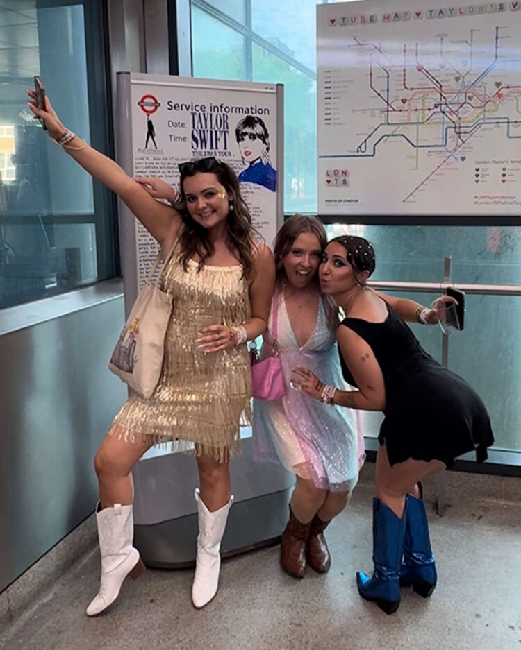 Fans attending Taylor Swift's The Eras Tour pose in front of TfL's Swift-themed Tube map at Wembley Park Tube station. // Credit: Transport for London