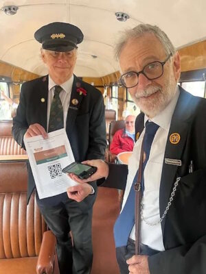 Travelling Ticket Inspectors Lester Halling and Alan Stanton try out one of the ticket scanners. // Credit: Lesley Carr