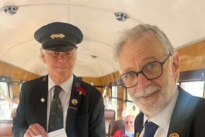 Travelling Ticket Inspectors Lester Halling and Alan Stanton try out one of the ticket scanners. // Credit: Lesley Carr