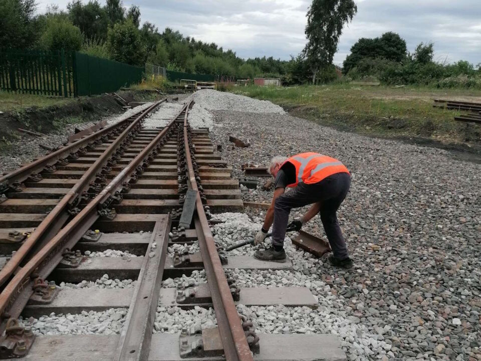 Volunteer working on the ballast at DLW