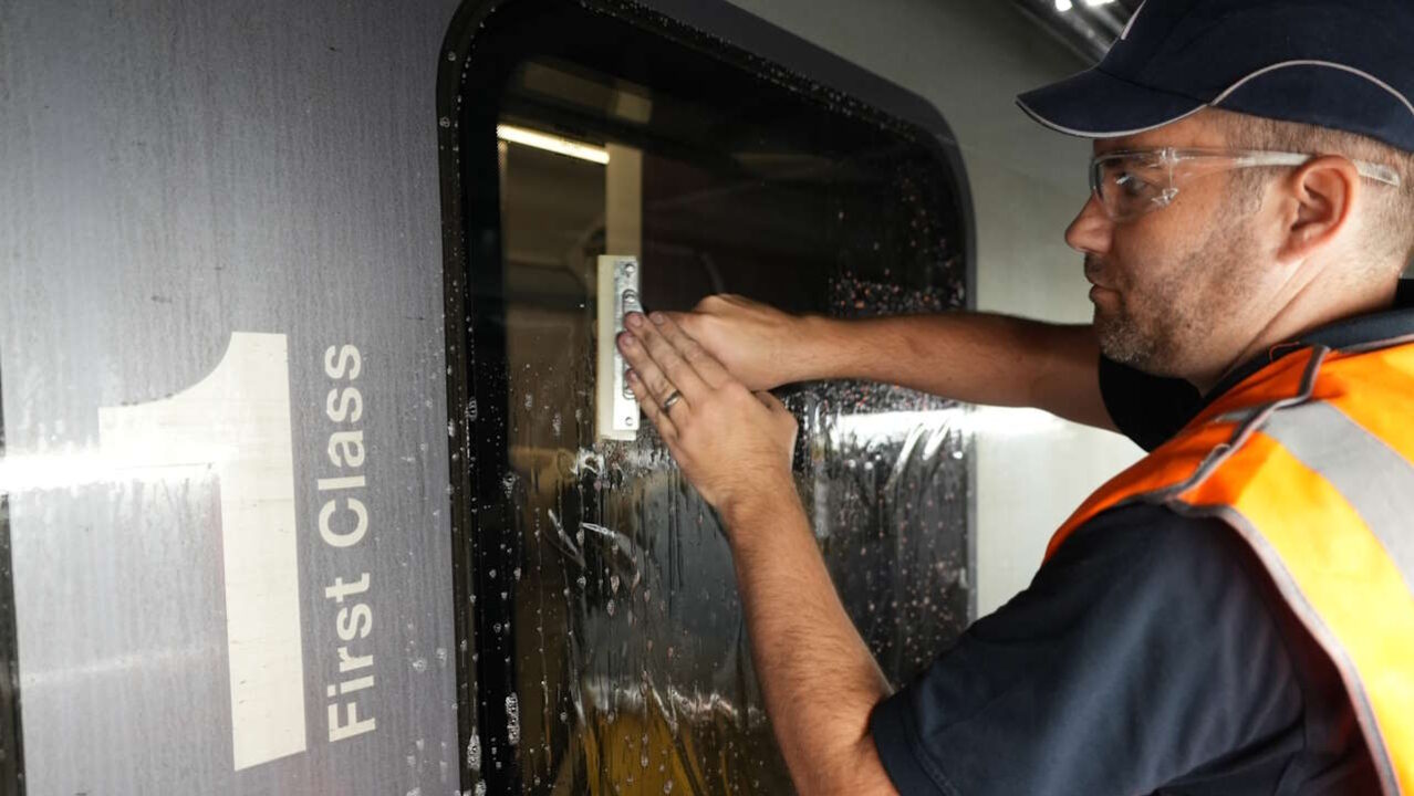 Window film being installed on a TPE train 