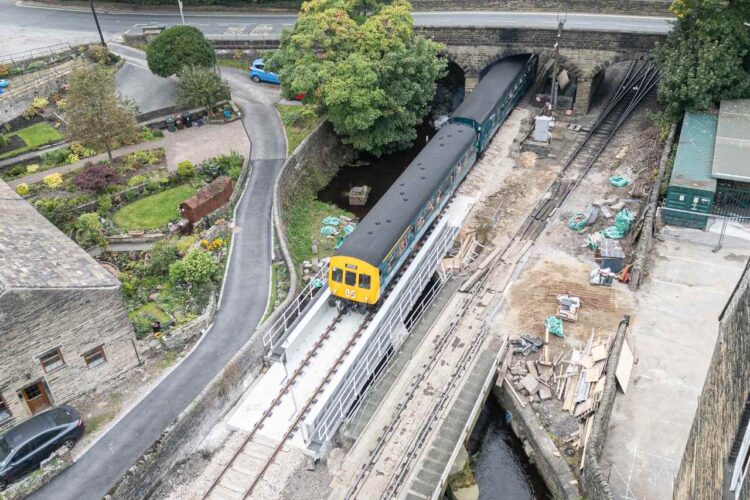 A class 101 DMU takes the volunteers over the bridge on the first train to cross the structure since completion - KWVR