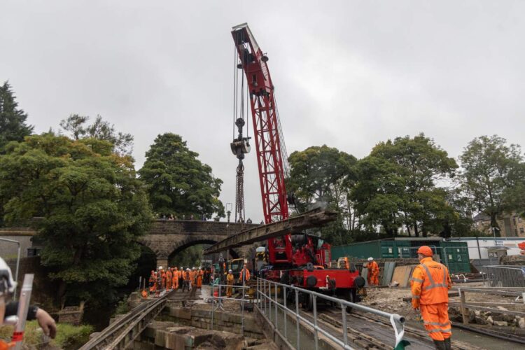 A steam crane removes the old track from the bridge - KWVR