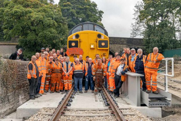 After all their hard effort's, KWVR volunteers stand on the renewed bridge after the projects completion - KWVR