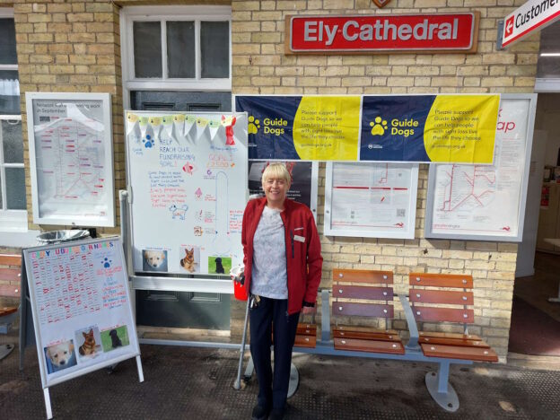 Customer service team member by the guide dogs fundraising area. // Credit: Greater Anglia