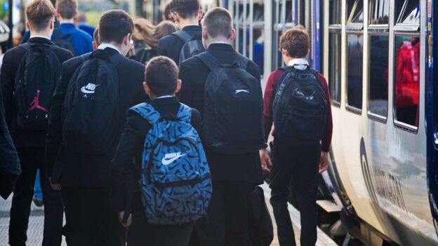 Schoolchildren leaving a Northern commuter train. // Credit: Northern